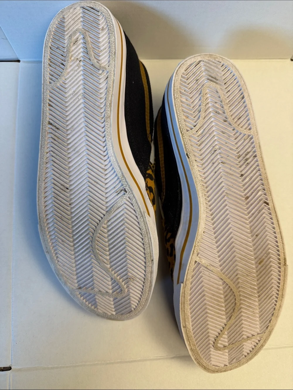 Nike Slip-On Sneakers in Black and Yellow Leopard Print